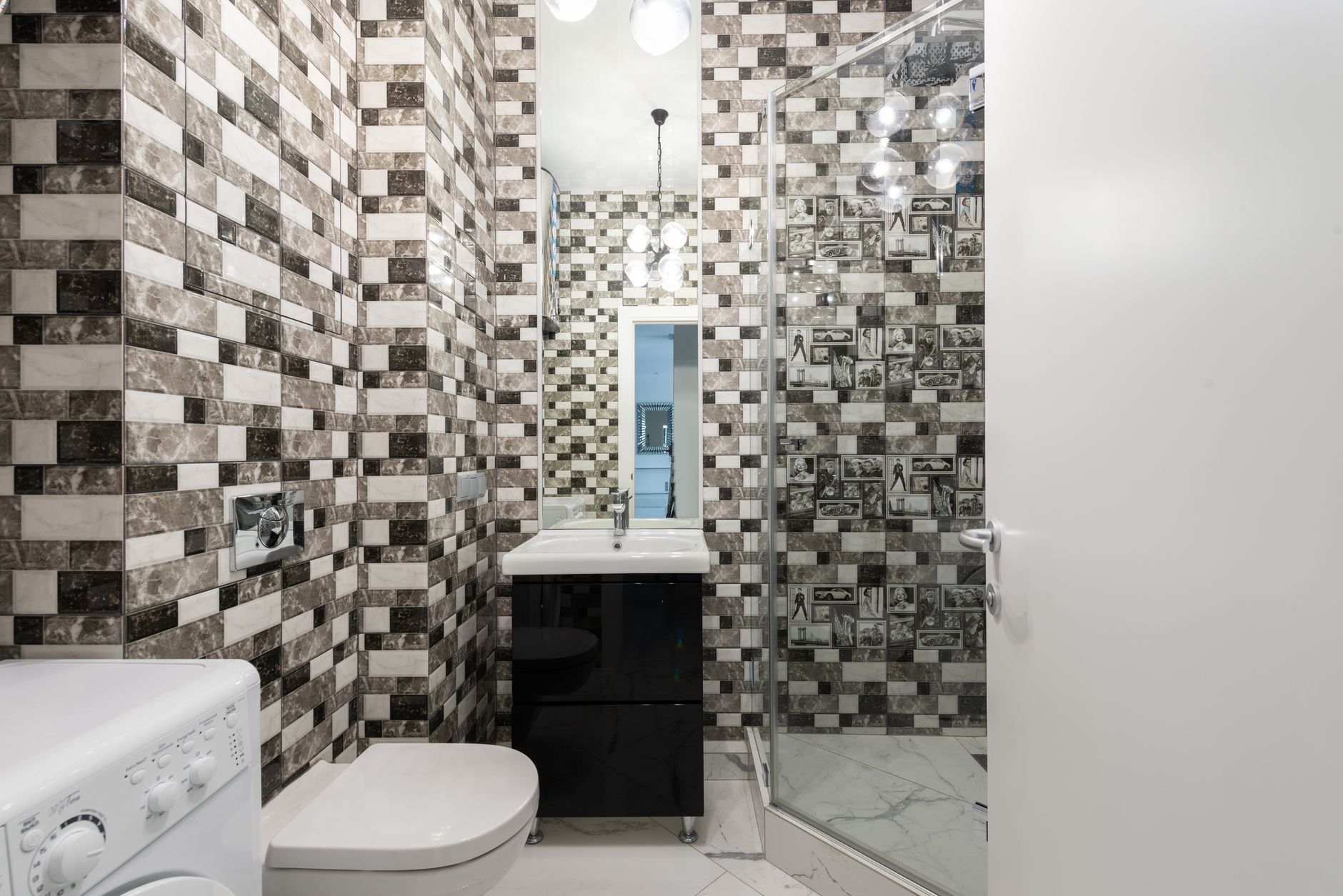 Compact bathroom with walk-in shower and mosaic tile