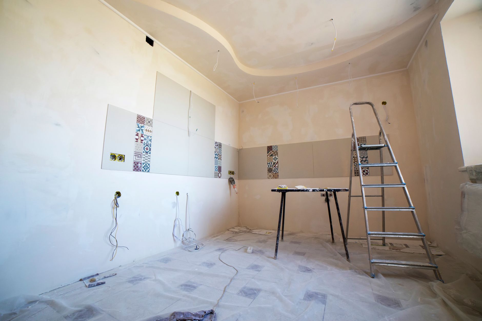 Same room during construction, unfinished walls and dust sheets