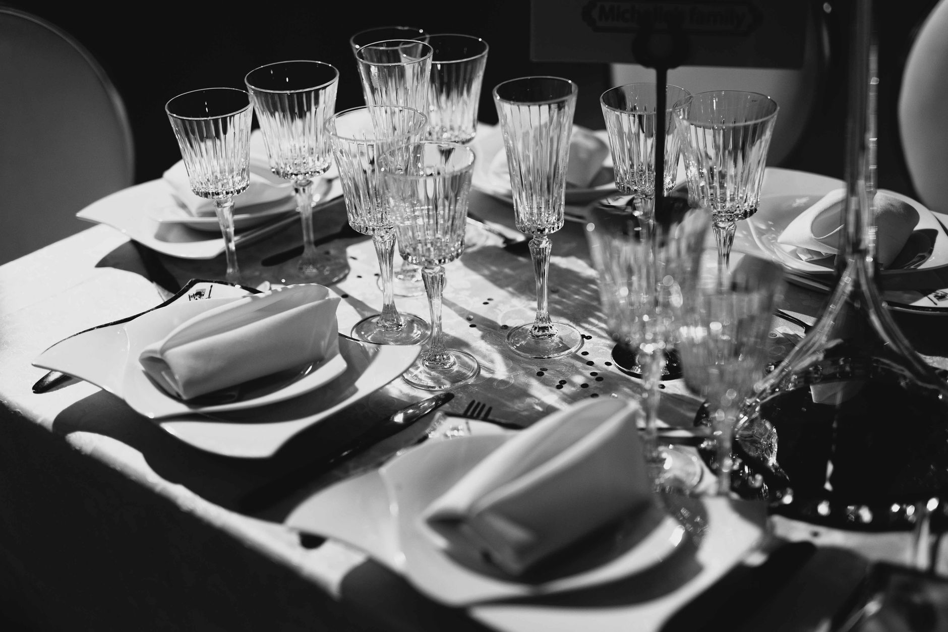 Wedding table with crystal glassware and folded napkins