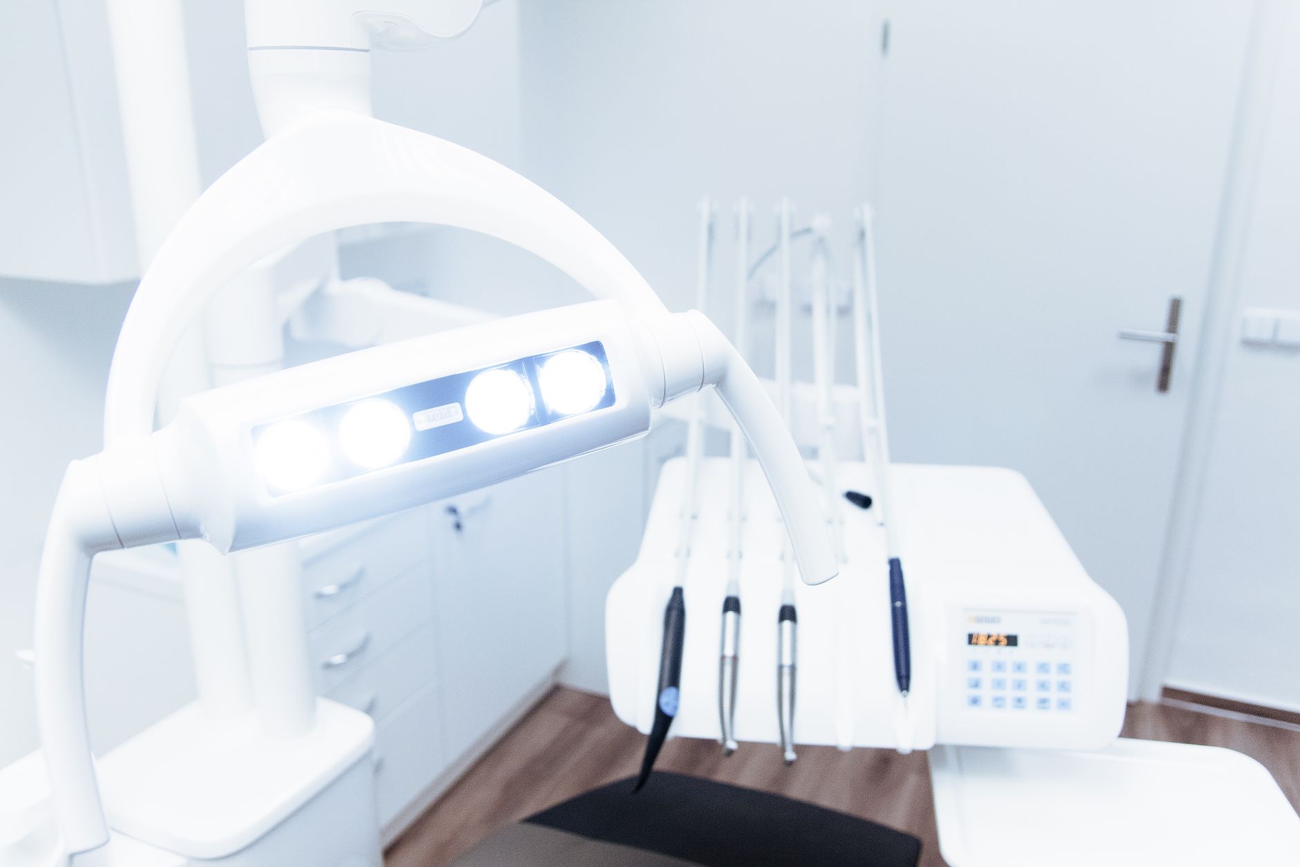Modern dental chair and overhead light