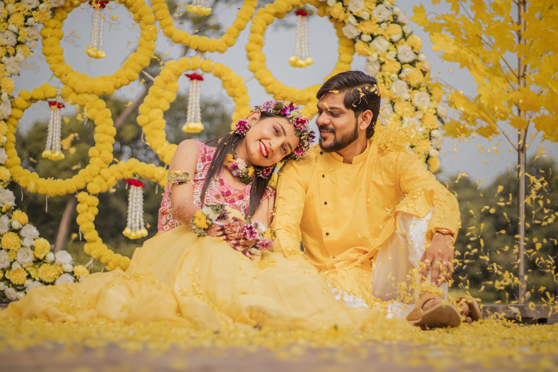 Couple surrounded by yellow flowers